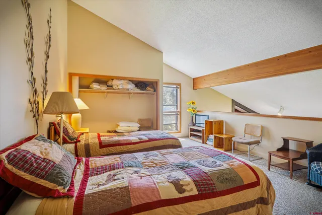 a bedroom with a bed and window