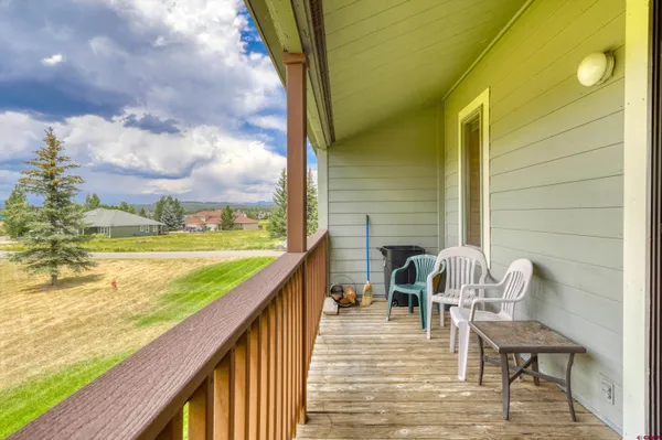 a view of a balcony with chairs