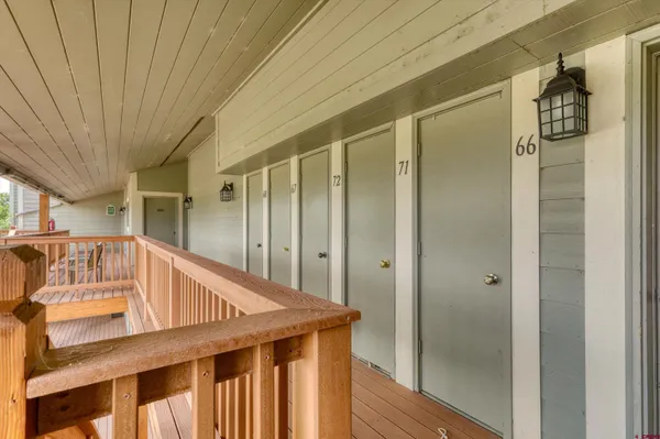 a view of stairs and wooden floor