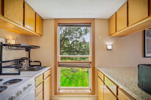 a view of a kitchen with a window