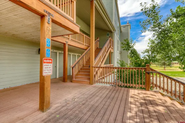 a view of balcony with furniture