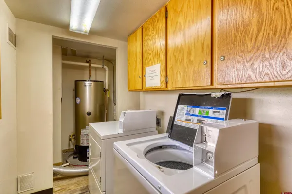 a kitchen with a refrigerator a stove top oven a sink and dishwasher