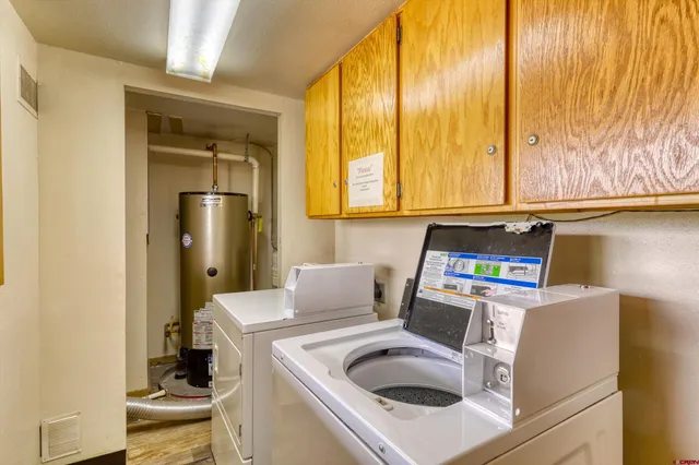 a kitchen with a refrigerator a stove top oven a sink and dishwasher