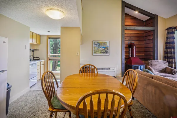 a view of a dining room with furniture