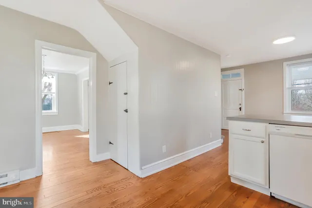 a view of a kitchen with wooden floor