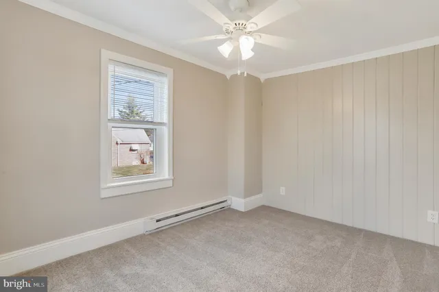 an empty room with a empty space and windows