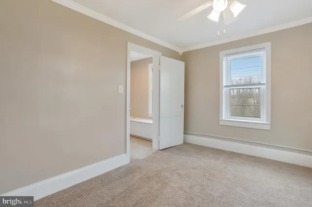 a white toilet sitting next to a bath tub
