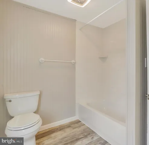 a bathroom with a sink vanity and mirror