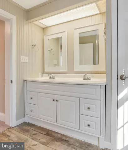 a bathroom with a toilet a sink and a window