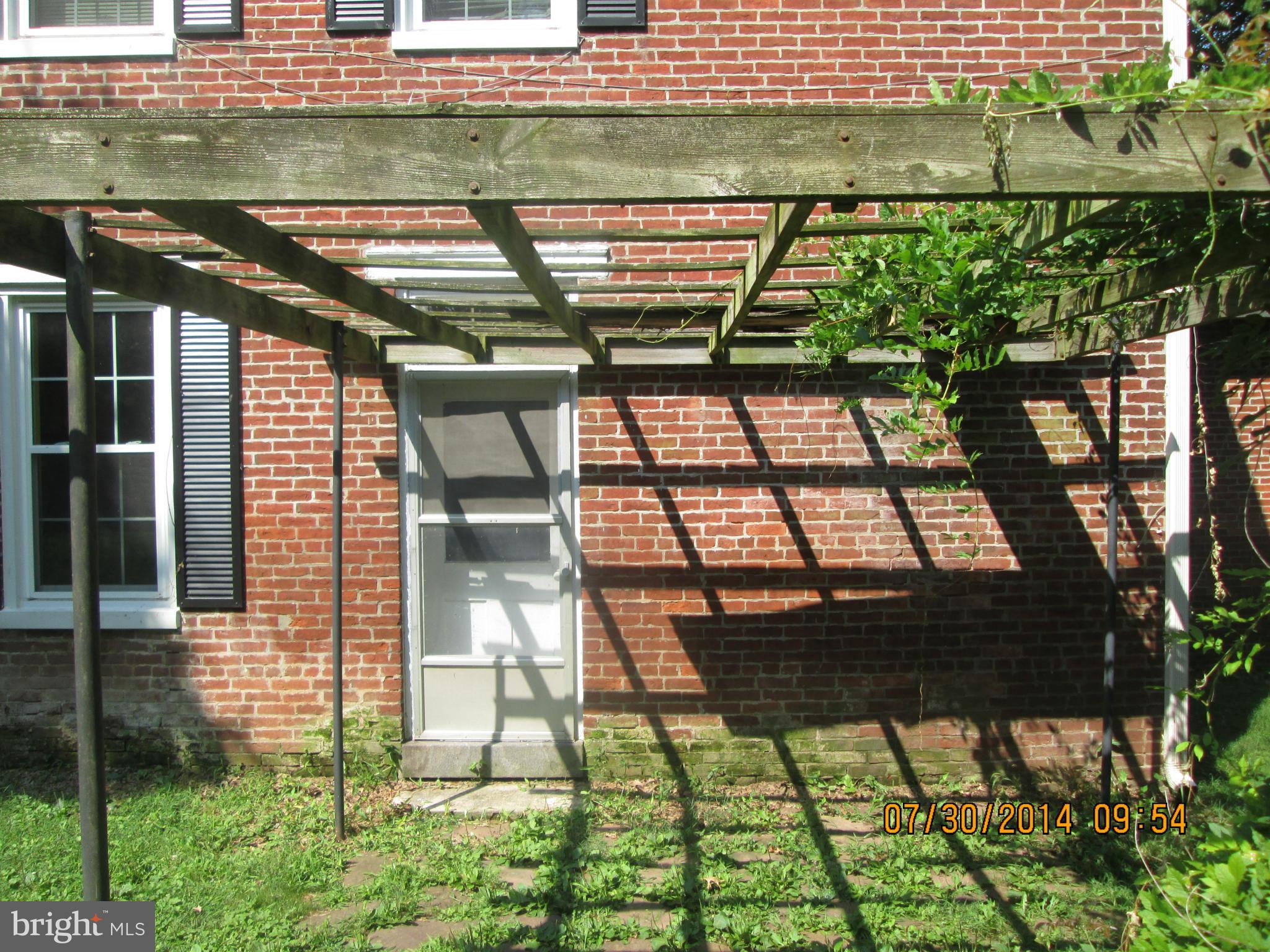 7550 Middleburg Road Keymar, MD 21757 - Photo 7 of 11 a backyard of a house with lots of green space and glass windows