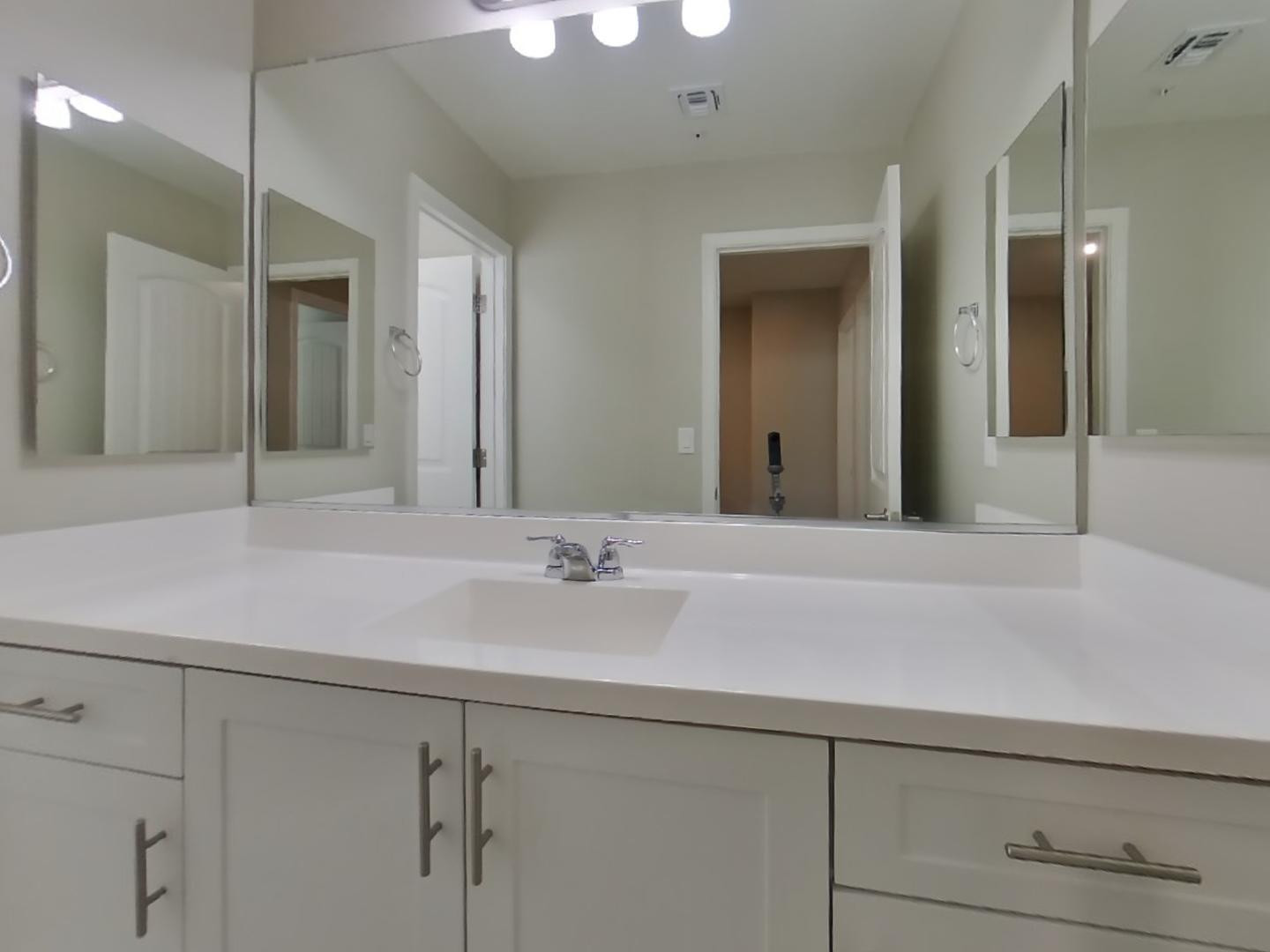 12565 West Via Dona Road Peoria, AZ 85383 - Photo 16 of 17 a bathroom with a sink and a mirror