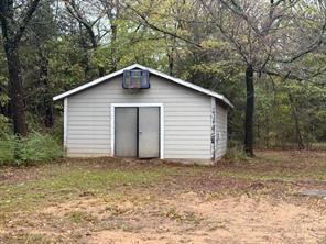 426 Gun Club Road Denison, TX 75021 - Photo 20 of 20 a house with a small yard and large tree