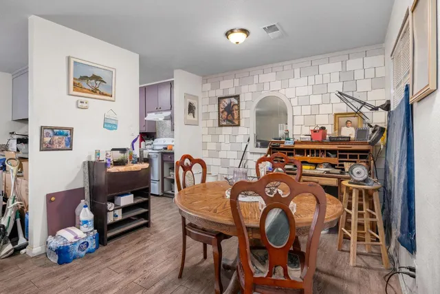 a view of a livingroom with furniture and workspace