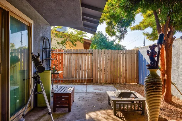 a view of a chairs and table in the balcony