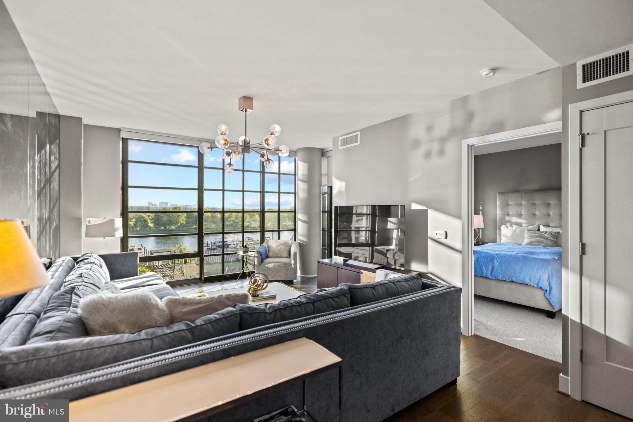 45 Sutton Square Southwest, Unit 503 Washington, DC 20024 - Photo 14 of 50 a living room with furniture and a window