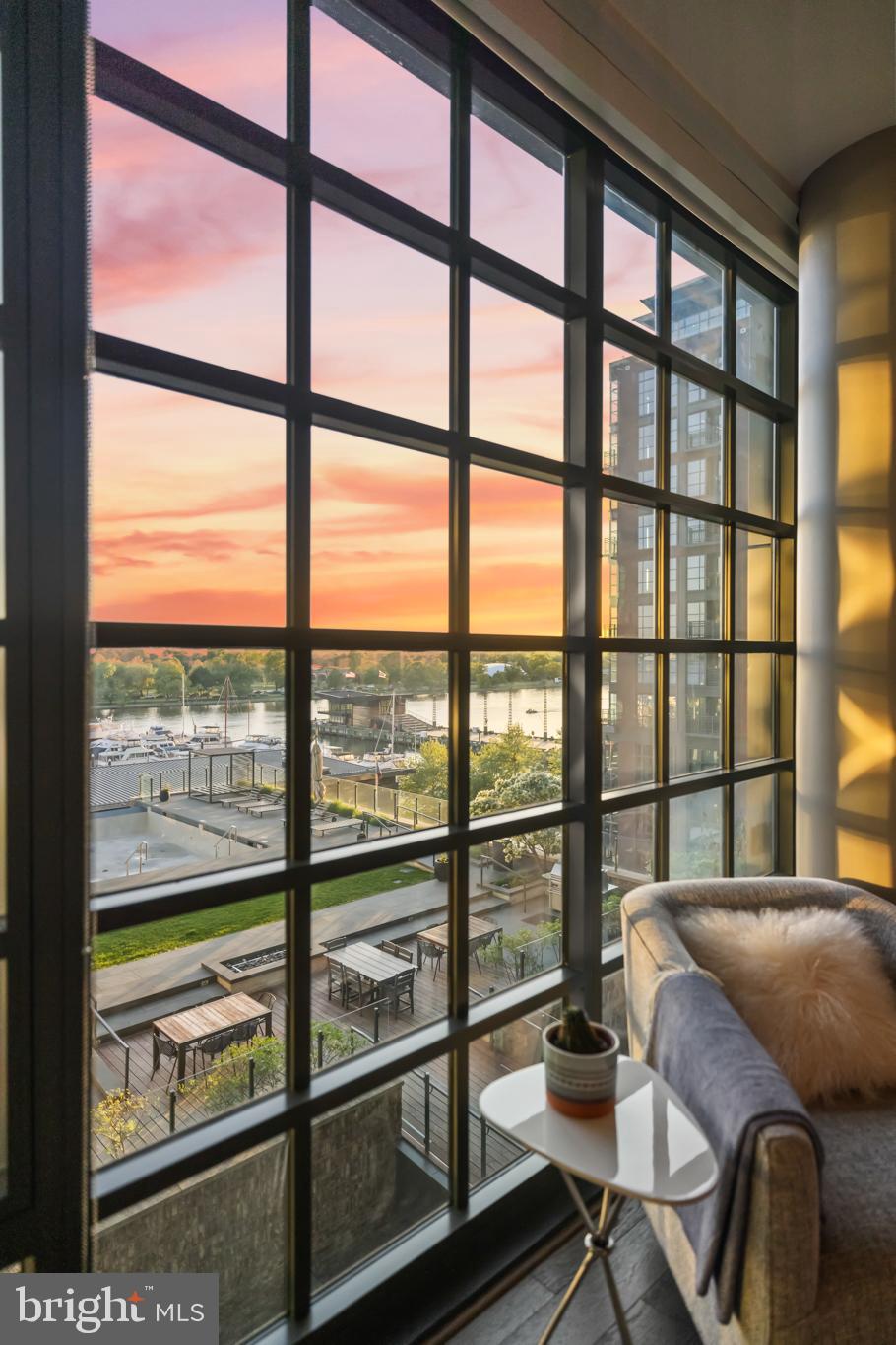 45 Sutton Square Southwest, Unit 503 Washington, DC 20024 - Photo 23 of 50 a bedroom with furniture and large windows