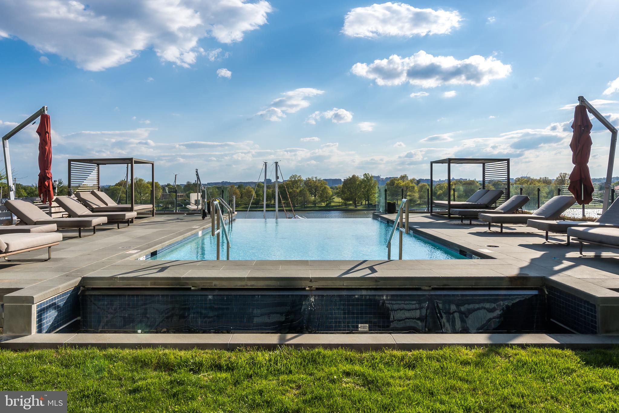 45 Sutton Square Southwest, Unit 503 Washington, DC 20024 - Photo 36 of 50 a view of a swimming pool with a yard