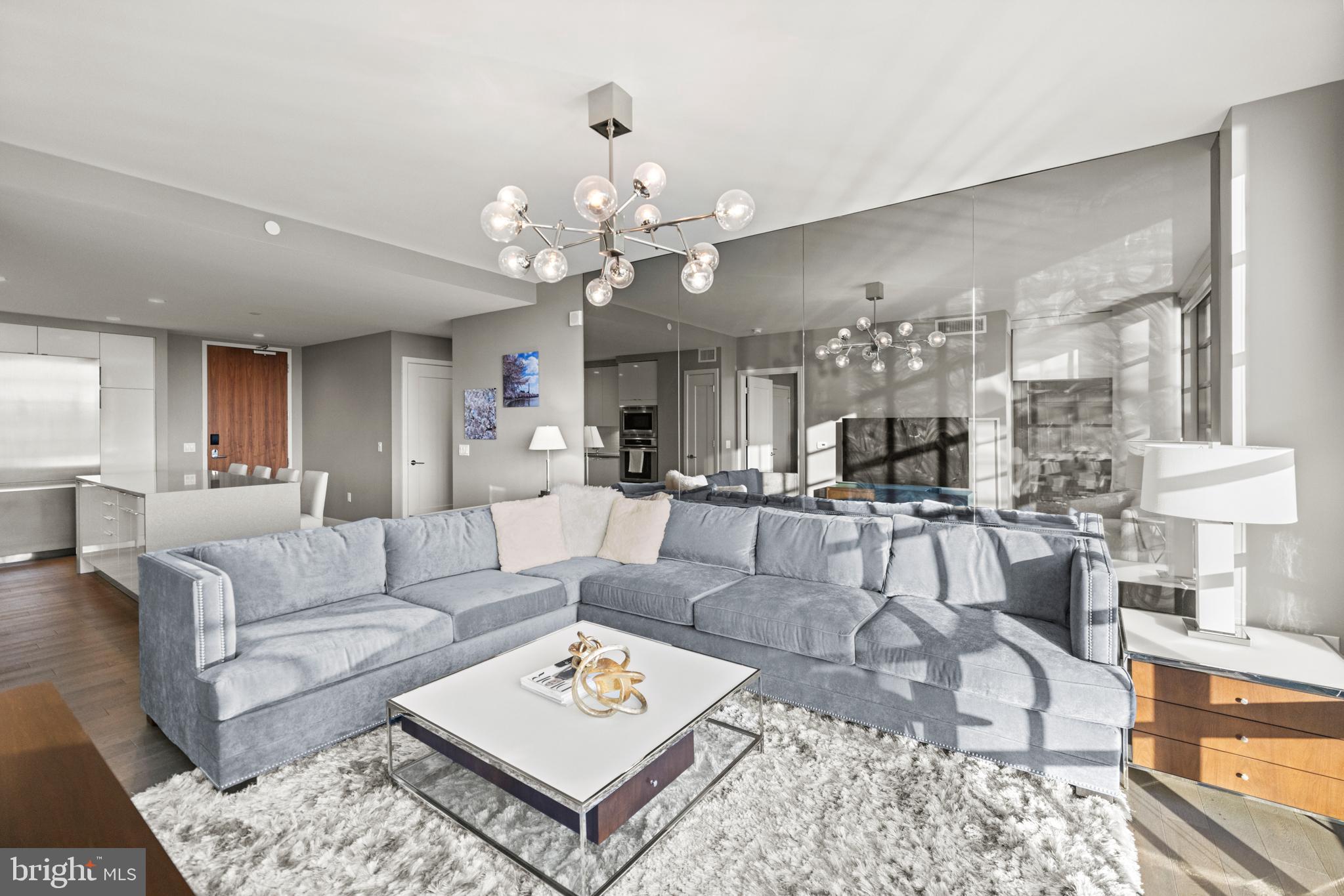 45 Sutton Square Southwest, Unit 503 Washington, DC 20024 - Photo 5 of 50 a living room with furniture kitchen view and a table