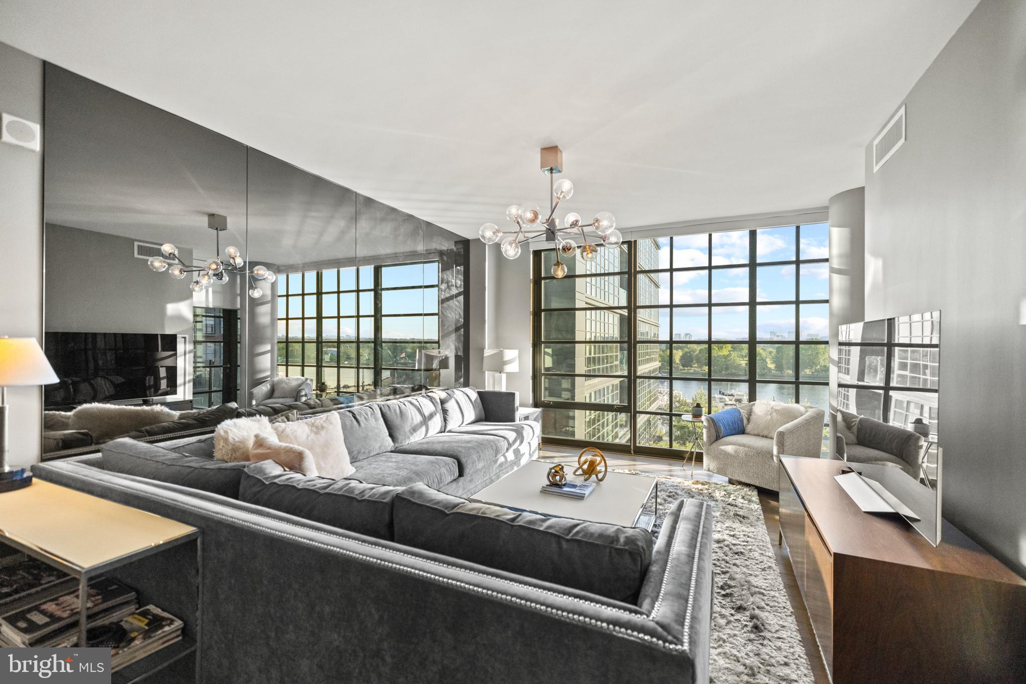 45 Sutton Square Southwest, Unit 503 Washington, DC 20024 - Photo 6 of 50 a living room with furniture and a large window