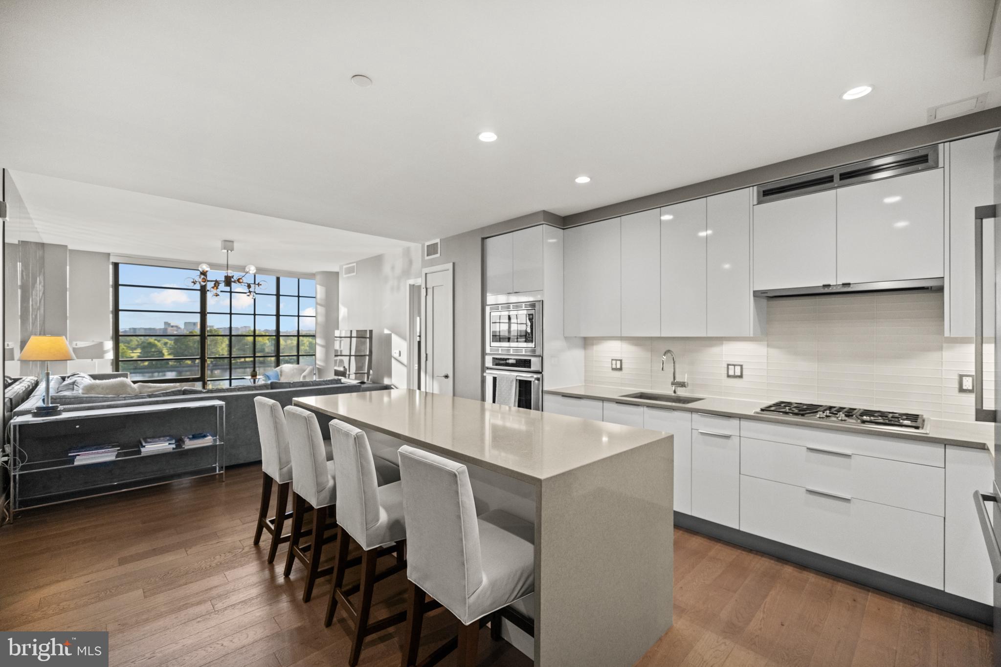 45 Sutton Square Southwest, Unit 503 Washington, DC 20024 - Photo 8 of 50 a kitchen with appliances a sink and cabinets