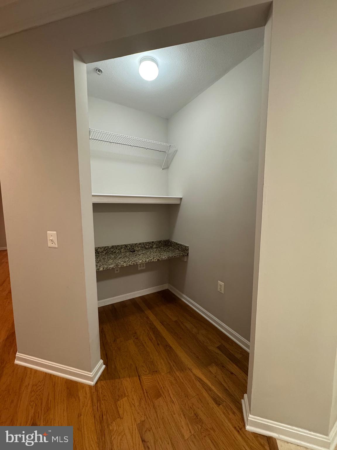 9486 Virginia Center Boulevard, Unit 114 Vienna, VA 22181 - Photo 11 of 41 a view of room with wooden floor