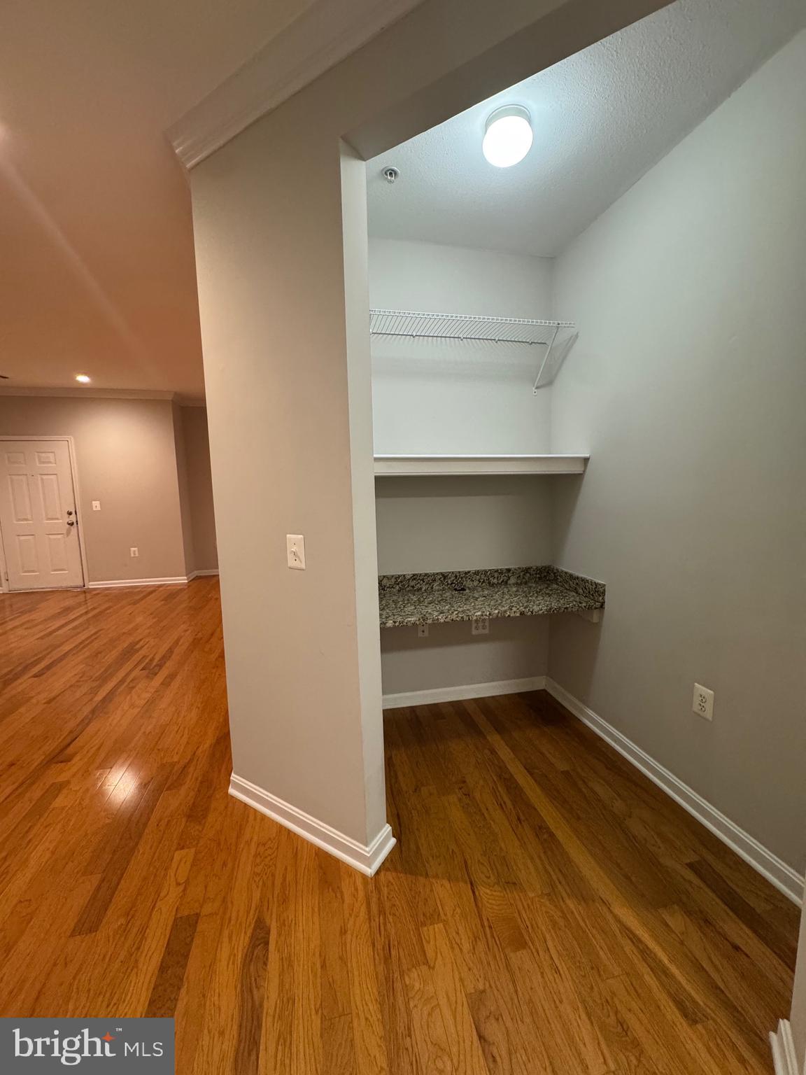 9486 Virginia Center Boulevard, Unit 114 Vienna, VA 22181 - Photo 12 of 41 a view of a room with wooden floor