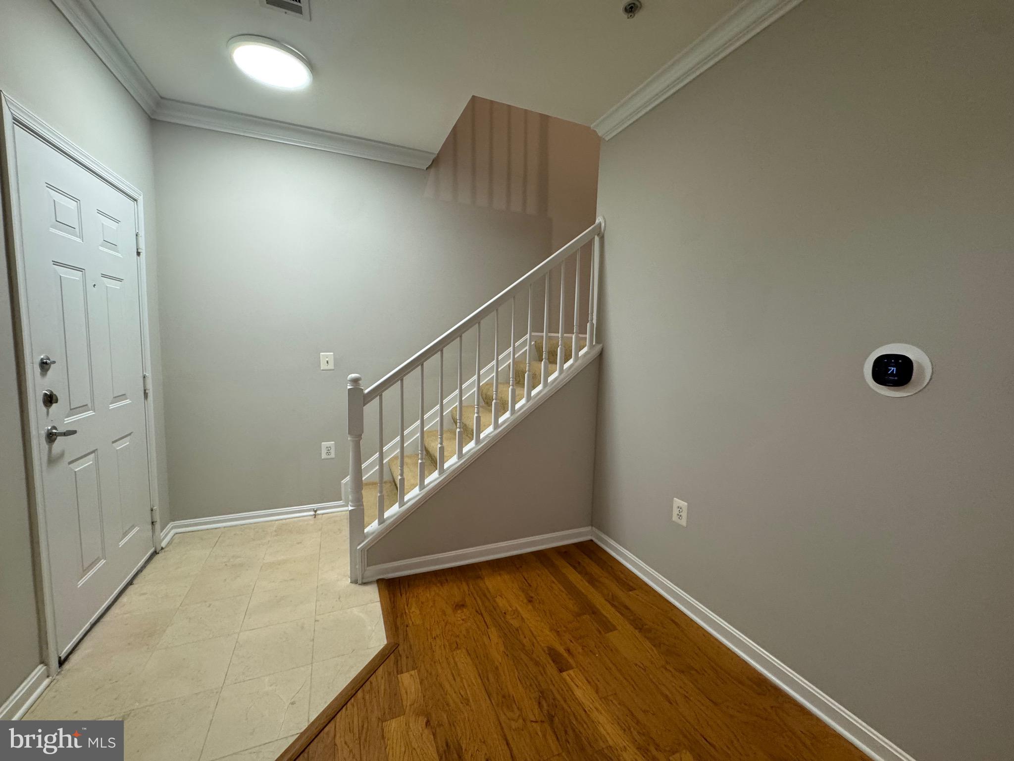 9486 Virginia Center Boulevard, Unit 114 Vienna, VA 22181 - Photo 13 of 41 a view of entryway with wooden floor