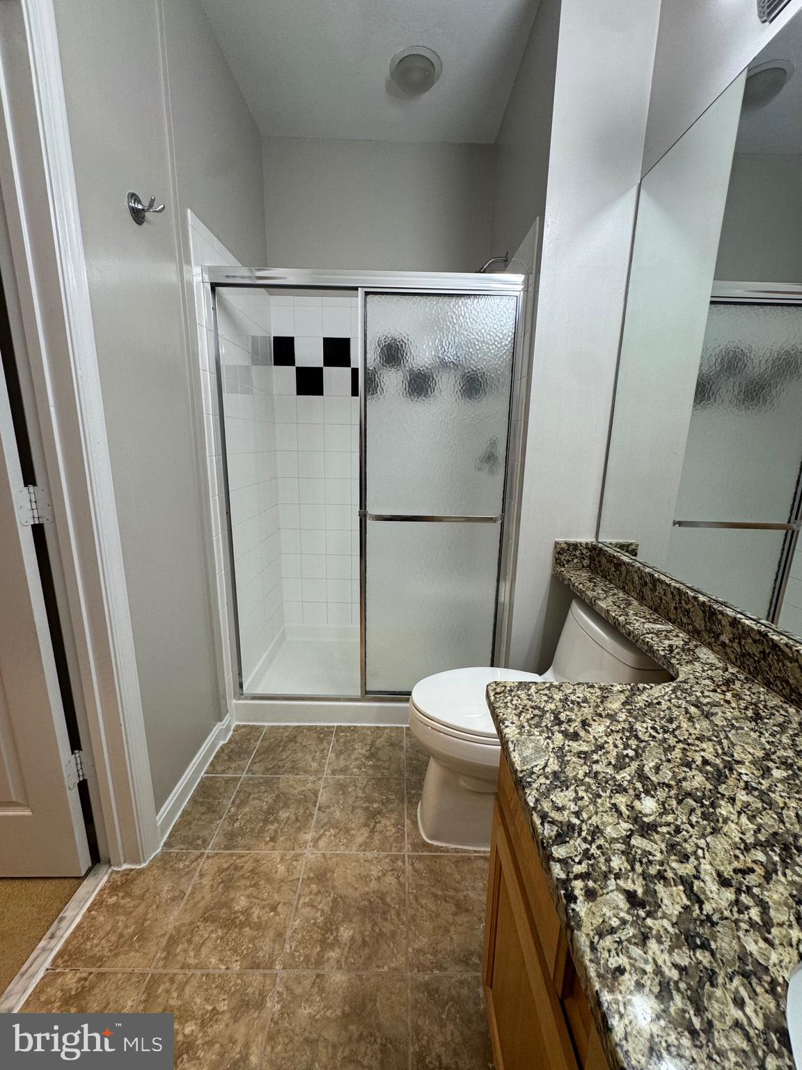 9486 Virginia Center Boulevard, Unit 114 Vienna, VA 22181 - Photo 20 of 41 a bathroom with a bathtub and shower