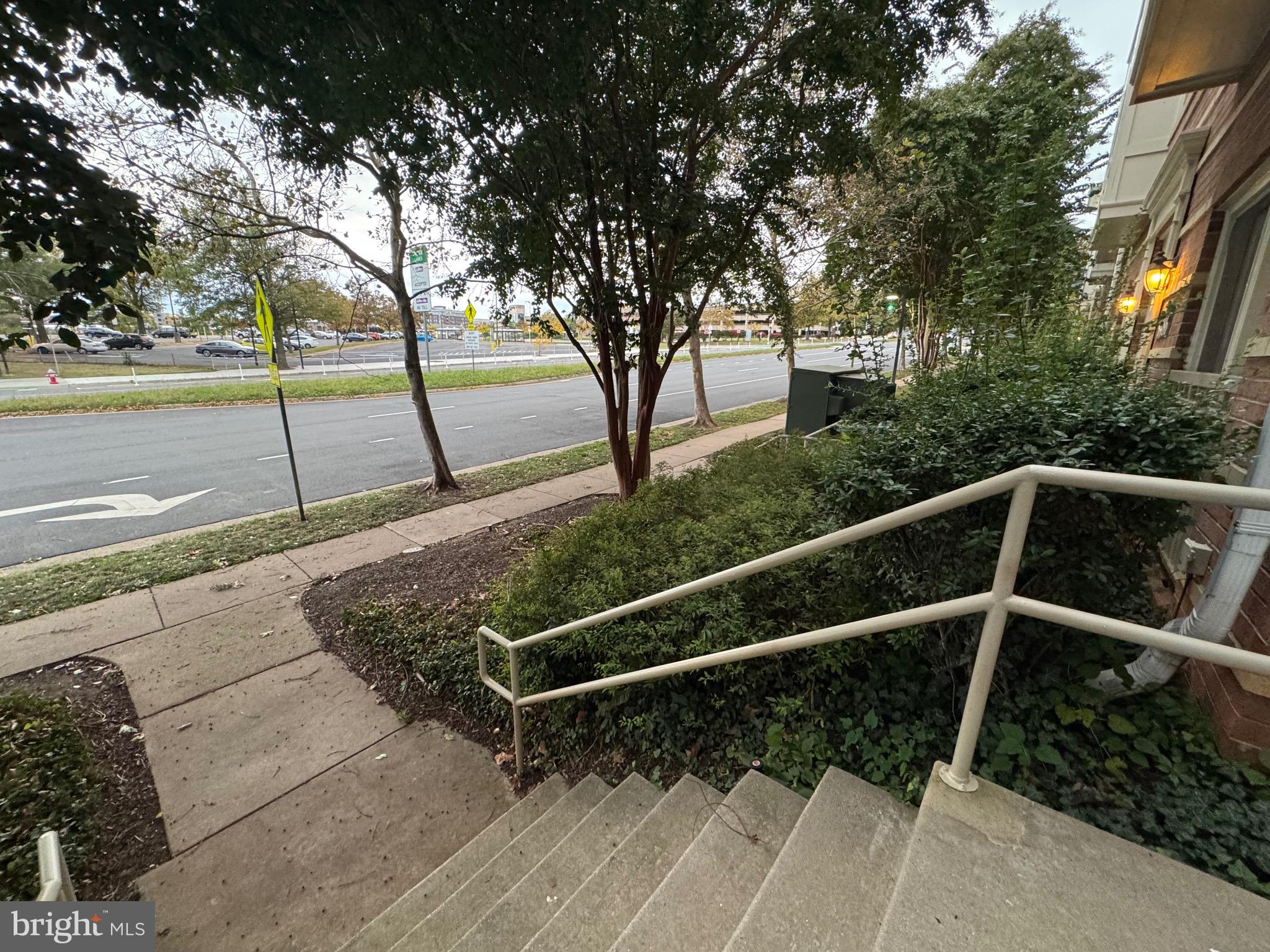 9486 Virginia Center Boulevard, Unit 114 Vienna, VA 22181 - Photo 29 of 41 a view of a yard with wooden floor and fence