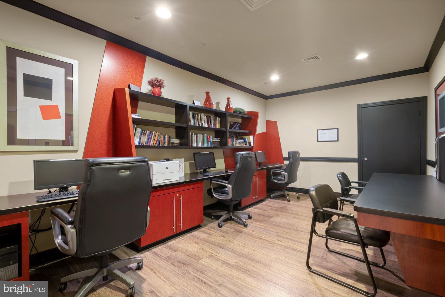9486 Virginia Center Boulevard, Unit 114 Vienna, VA 22181 - Photo 37 of 41 a view of a workspace with furniture and a window