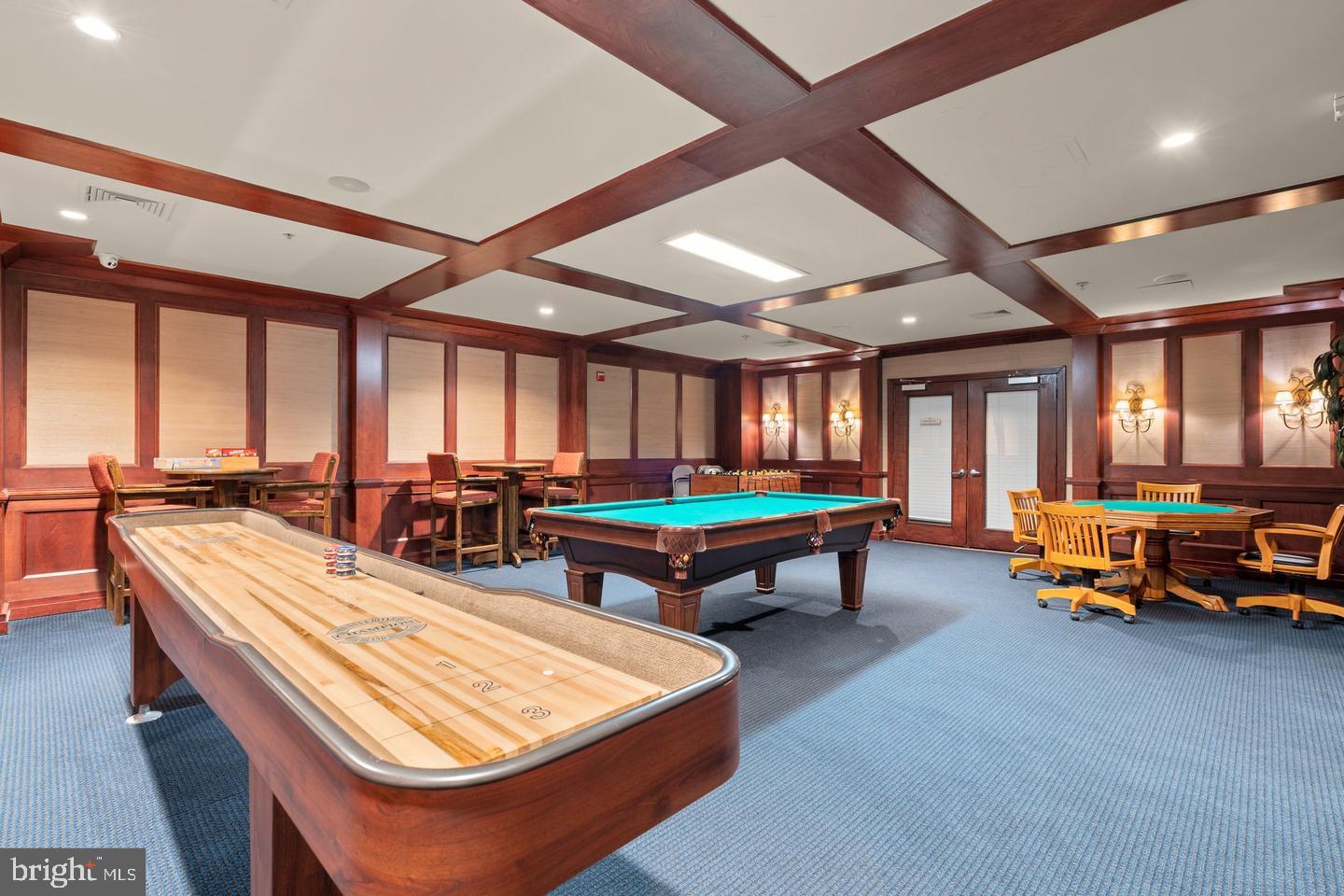 9486 Virginia Center Boulevard, Unit 114 Vienna, VA 22181 - Photo 38 of 41 a room with furniture and a table