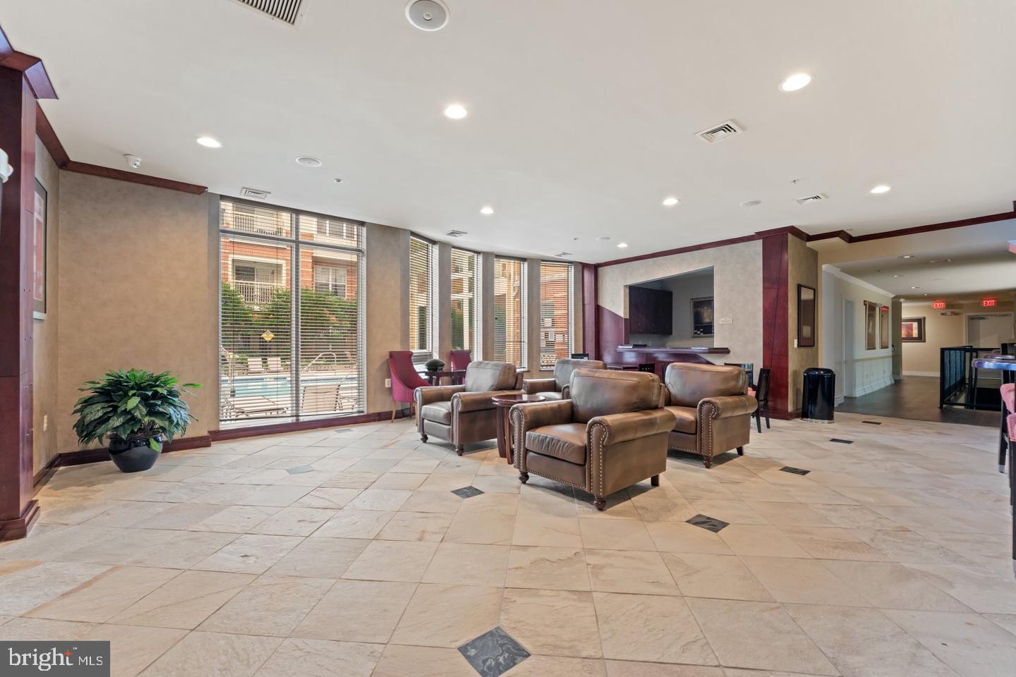 9486 Virginia Center Boulevard, Unit 114 Vienna, VA 22181 - Photo 39 of 41 a living room with furniture