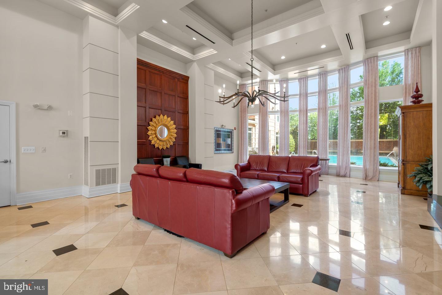 9486 Virginia Center Boulevard, Unit 114 Vienna, VA 22181 - Photo 41 of 41 a living room with furniture and a large window