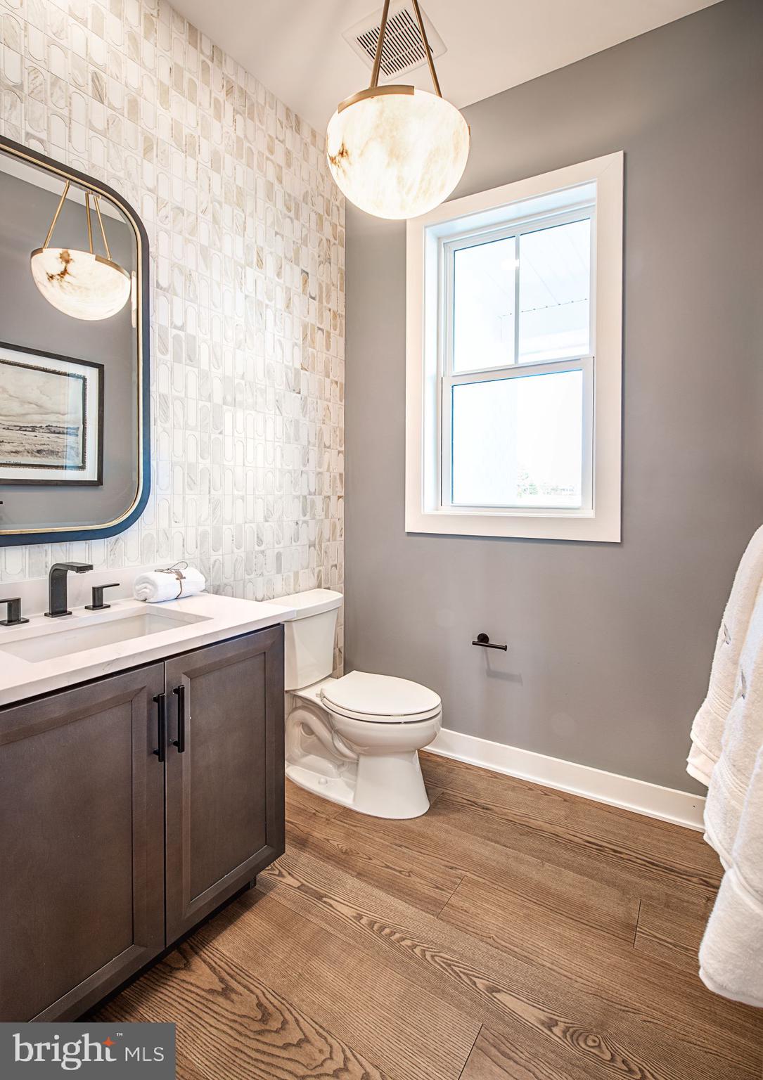 Stony Road, Unit CLOVERFIELD Warminster, PA 18974 - Photo 13 of 28 a bathroom with a toilet sink and mirror