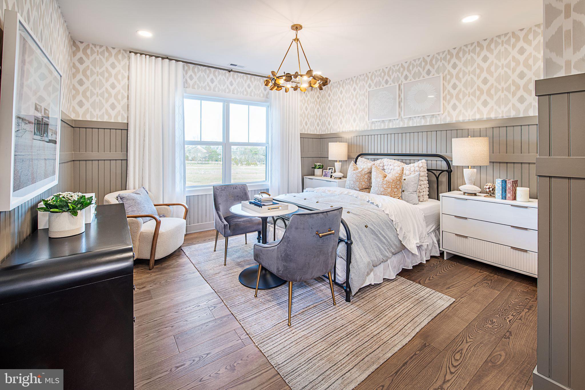 Stony Road, Unit CLOVERFIELD Warminster, PA 18974 - Photo 26 of 28 a bedroom with a bed and a chandelier
