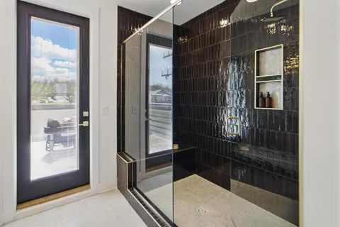 a bathroom with a shower and a sink