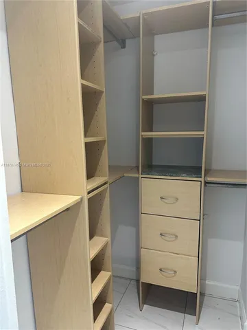 a view of an empty walk in closet