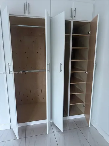 a view of an empty walk in closet