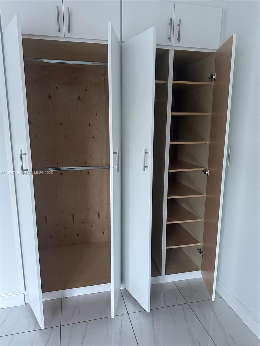 8400 Byron Avenue, Unit 2D Miami Beach, FL 33141 - Photo 17 of 21 a view of an empty walk in closet