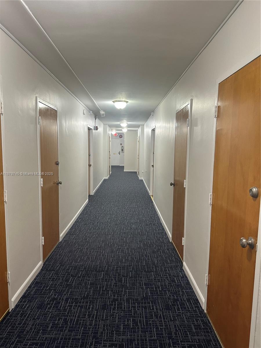 8400 Byron Avenue, Unit 2D Miami Beach, FL 33141 - Photo 2 of 21 a view of hallway with stainless steel appliances