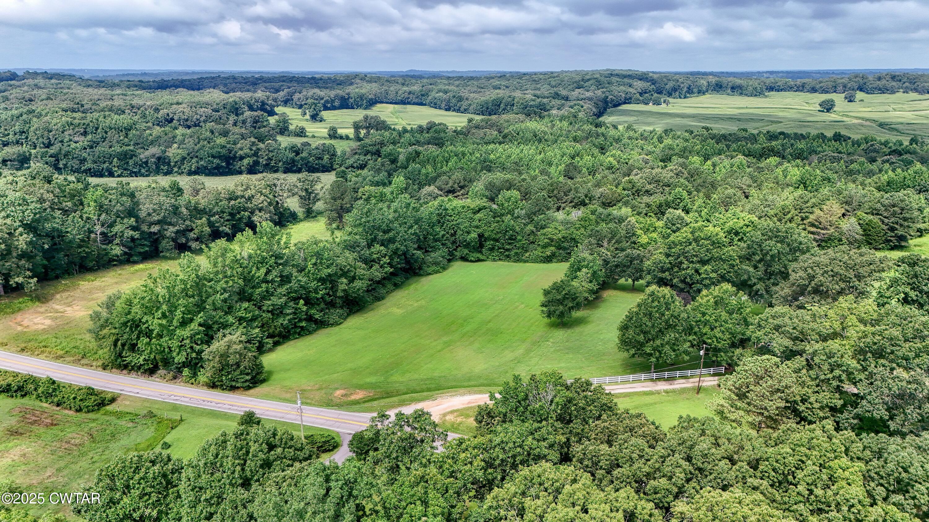 0 Highway 219 Huntingdon, TN 38344 - Photo 4 of 13 a view of a lush green outdoor space with a lake view and mountain view