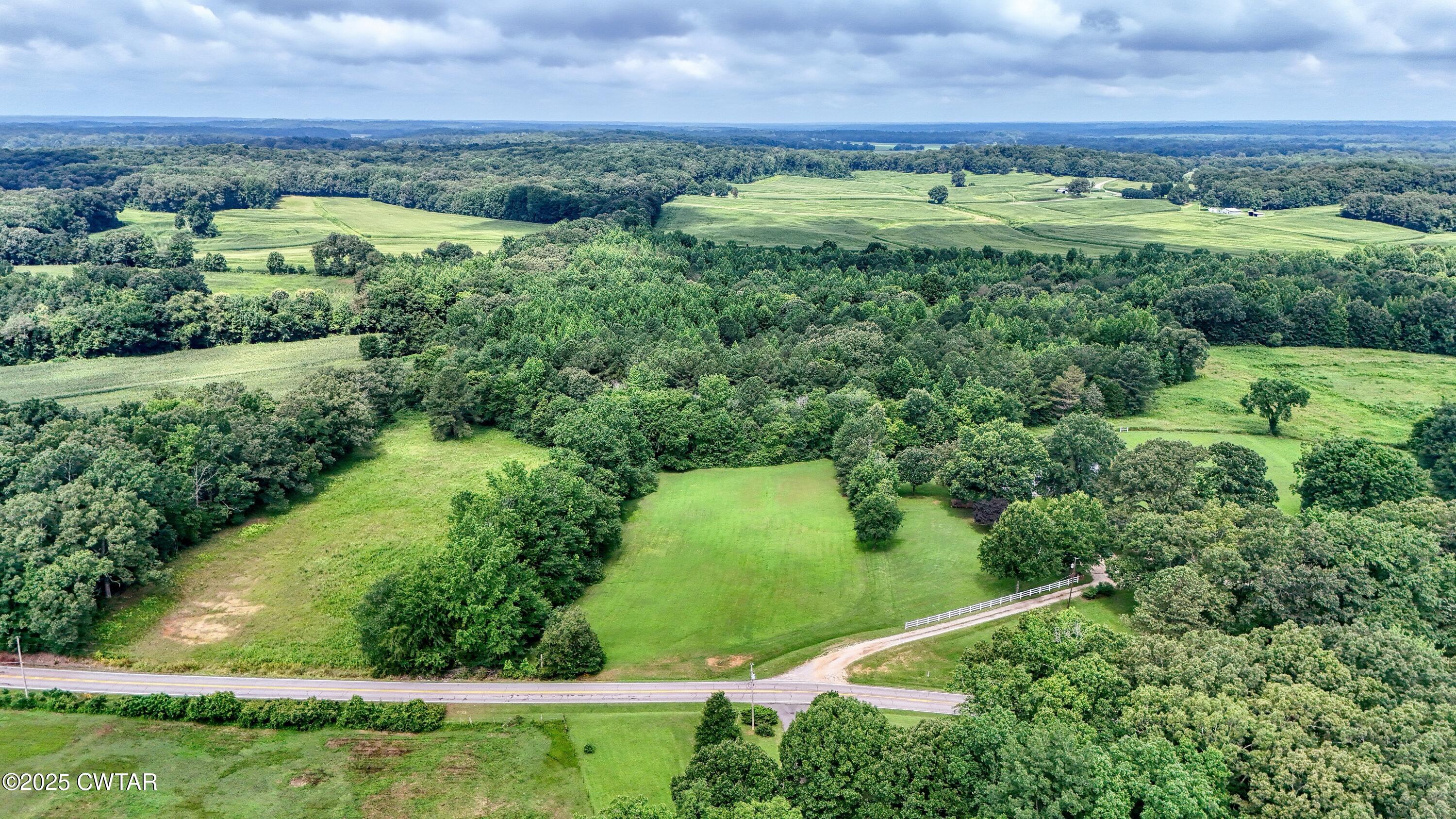 0 Highway 219 Huntingdon, TN 38344 - Photo 5 of 13 an aerial view of a residential houses with outdoor space and trees all around