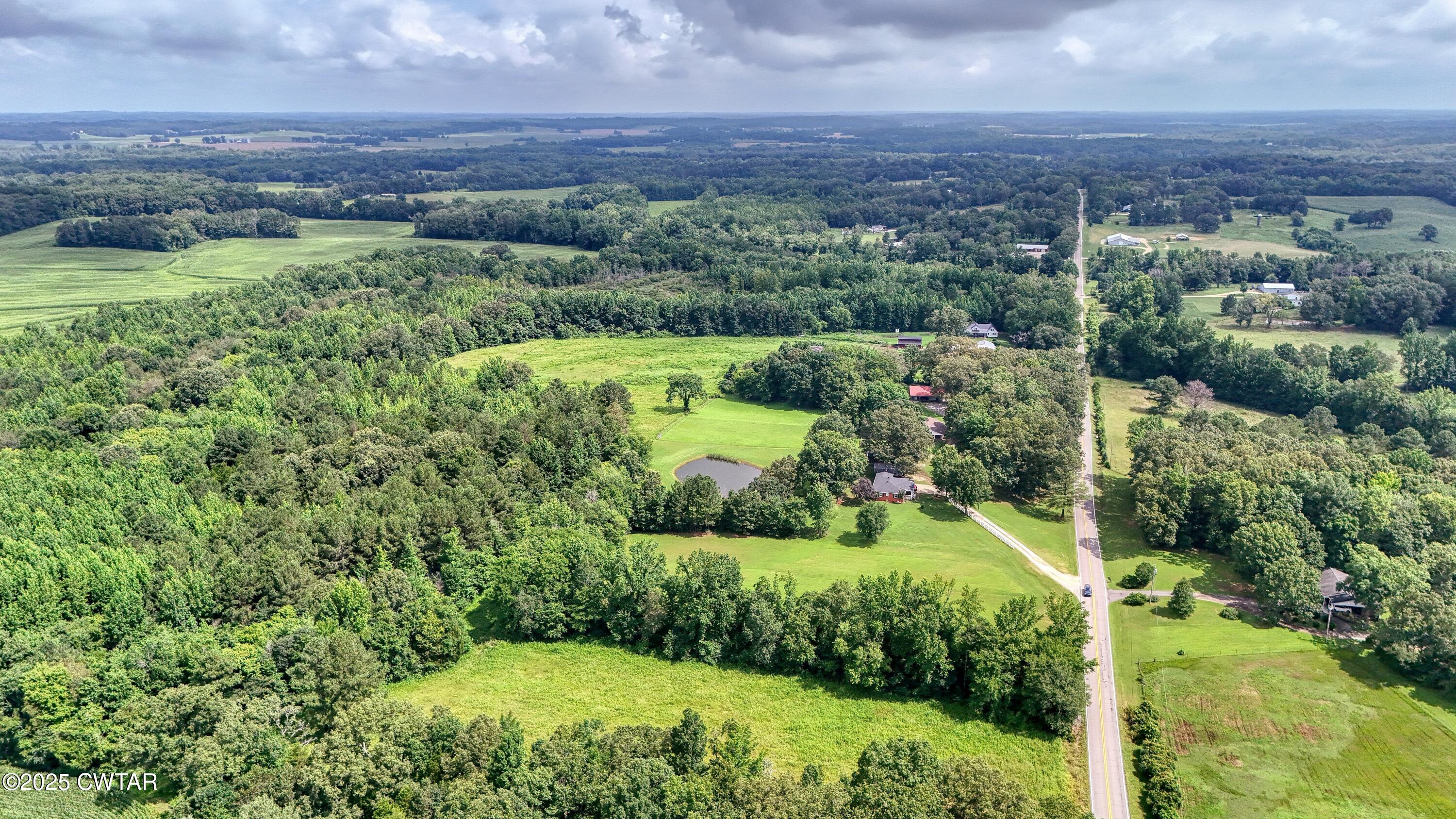 0 Highway 219 Huntingdon, TN 38344 - Photo 6 of 13 a view of a lush green forest with a houses