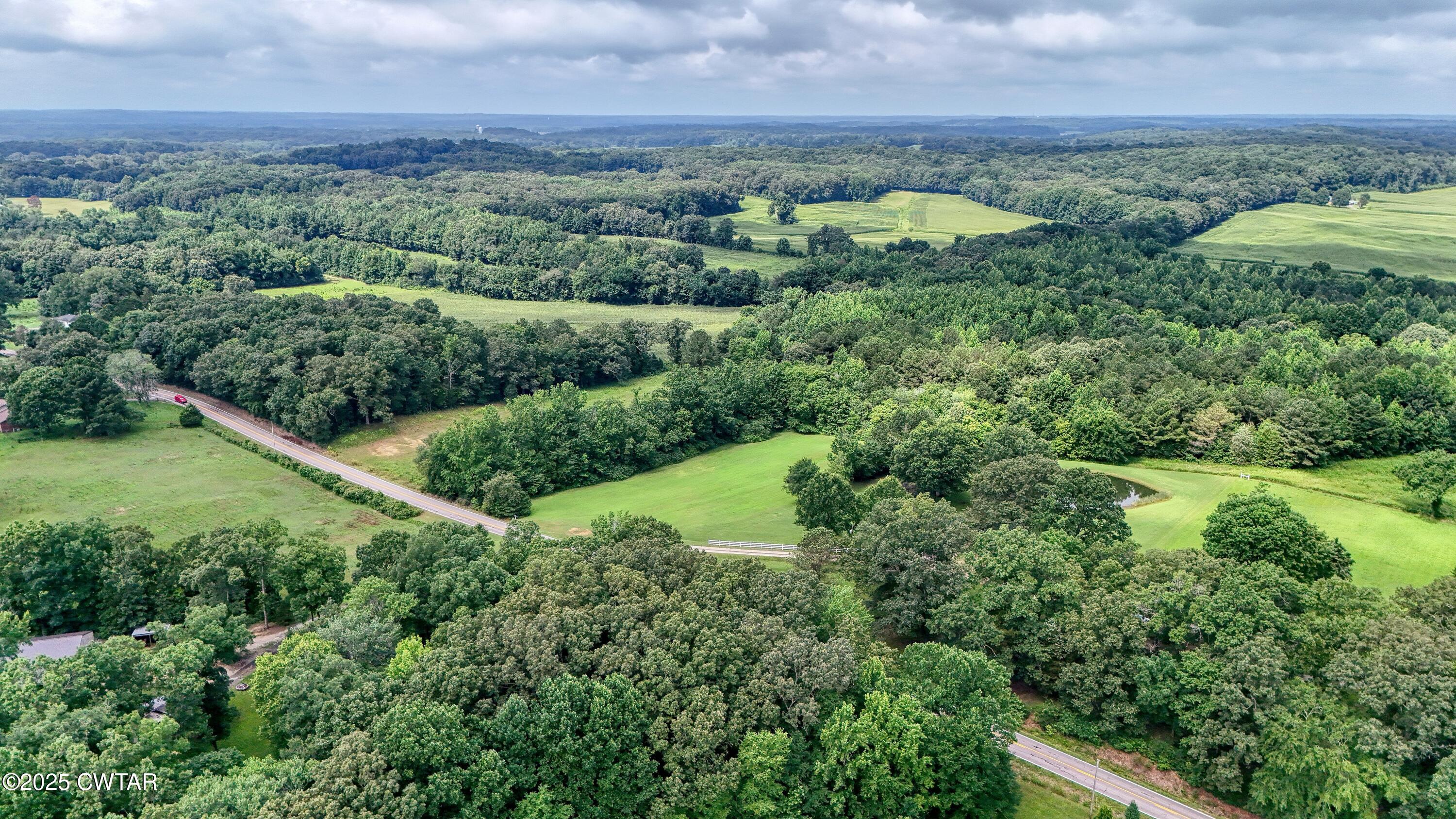0 Highway 219 Huntingdon, TN 38344 - Photo 8 of 13 an aerial view of residential houses with outdoor space and trees