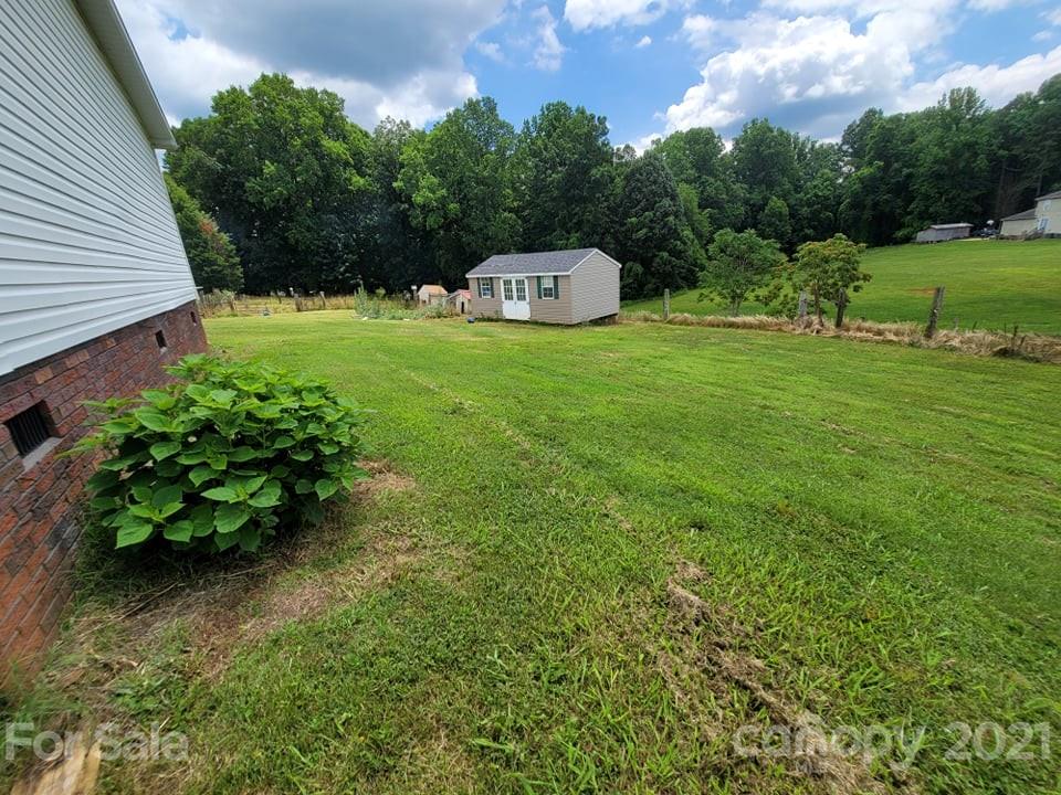 525 Baker Mill Road Cleveland, NC 27013 - Photo 12 of 35 a view of a garden with a swimming pool