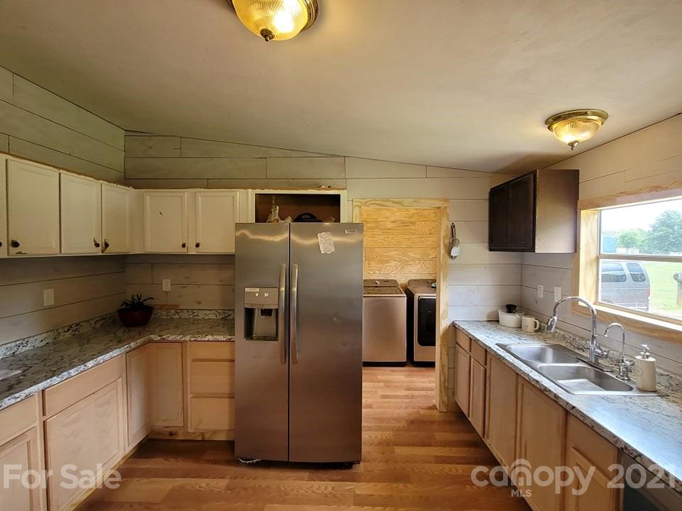 525 Baker Mill Road Cleveland, NC 27013 - Photo 22 of 35 a kitchen with a refrigerator sink and stove