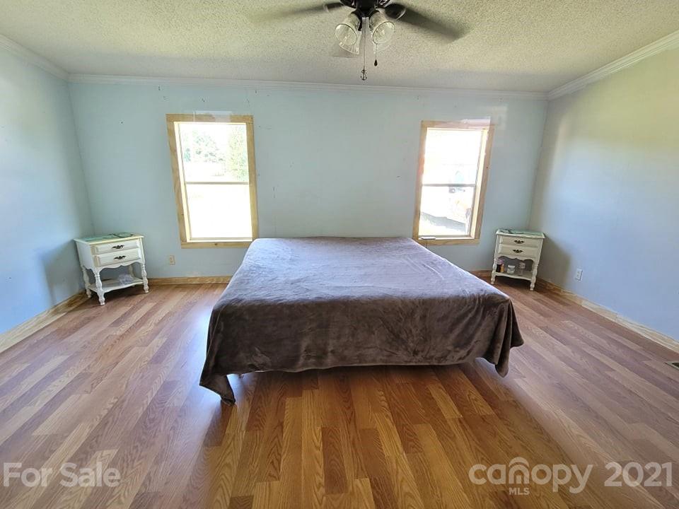 525 Baker Mill Road Cleveland, NC 27013 - Photo 24 of 35 a bedroom with a bed and window