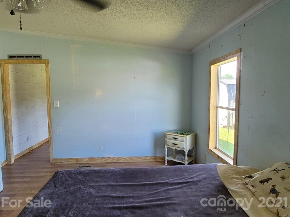 525 Baker Mill Road Cleveland, NC 27013 - Photo 25 of 35 a bedroom with a bed and a window