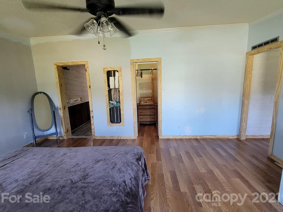 525 Baker Mill Road Cleveland, NC 27013 - Photo 26 of 35 a bedroom with a bed and a dresser
