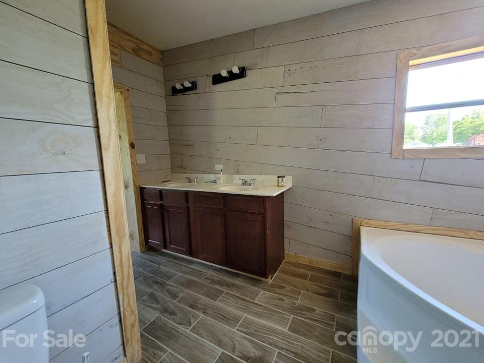 525 Baker Mill Road Cleveland, NC 27013 - Photo 28 of 35 a bathroom with a sink and a shower